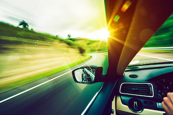 looking through car mirror on the road